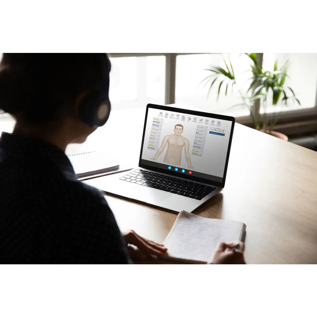 Nervous System Mapping & Bioenergetic Health Evaluation in progress on a laptop with a wellness report.